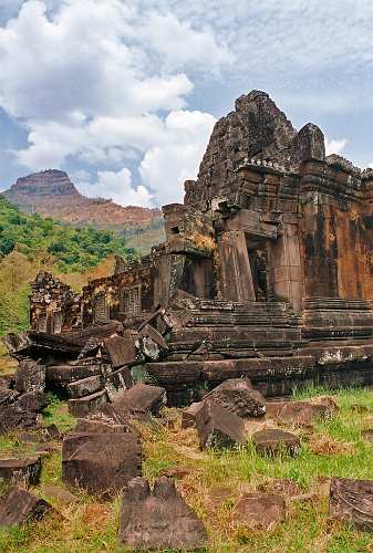 Vat-Phou_06 Part of Vat Phou Temple complex with the holy Phu Kao Mountain in background.
