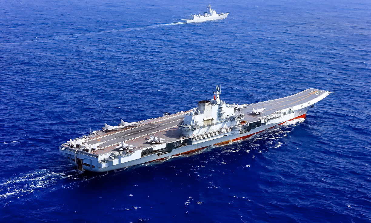 China's first aircraft carrier Liaoning (辽宁舰) in the waters of the South China Sea.