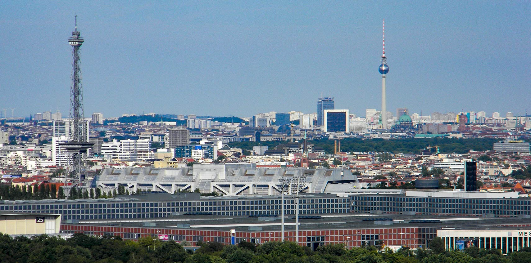 Berlin panorama seen from Berlin's ''Spy station'' on Teufelsberg with Berliner Funkturm and Berlin TV Tower, Messe Berlin fairgrounds and Internationales Congress Centrum Berlin (ICC)