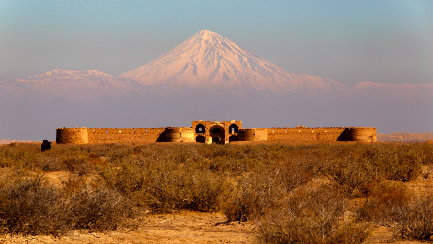 Dayr-e Gachin caravanserai and Mount Damāvand, Iran