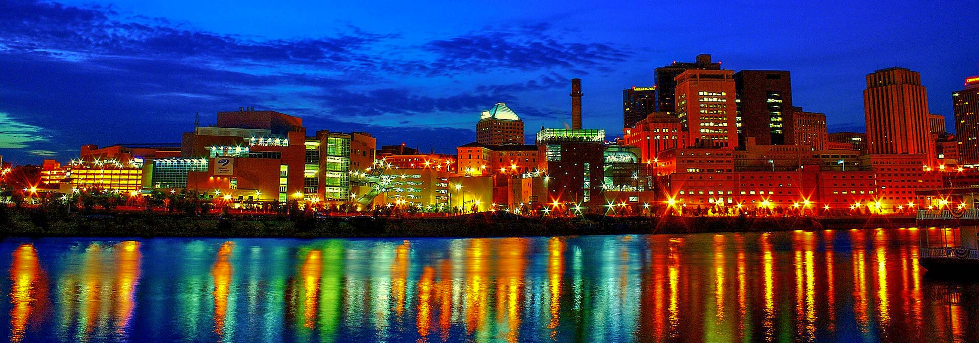 Downtown Saint Paul along the Mississippi River at dusk, seen from Harriet Island