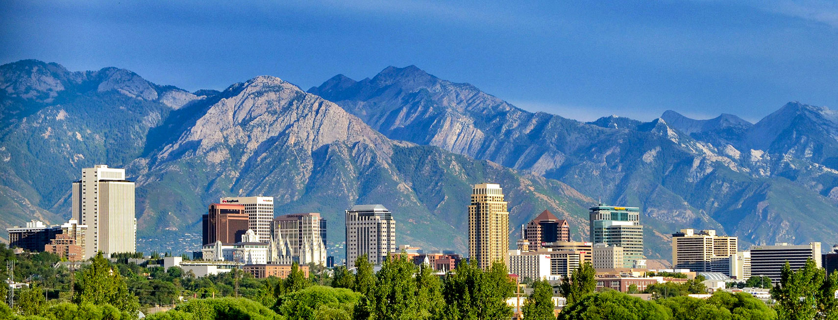 View of Salt Lake City skyline with Wasatch Mountain Range in the background