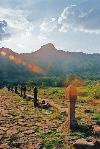 Vat-Phou, Main entrance to Vat Phou Temple complex, in background holy Phu Kao Mountain, the spiritual centre of the ancient Khmer Shrestapura area.
