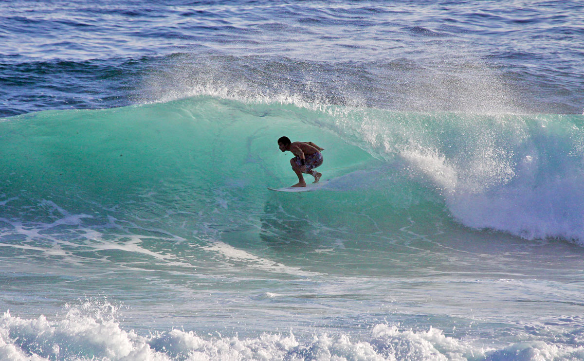 Surfing at the Soup Bowl surfing spot, a beach in Bathsheba on the east coast of Barbados.