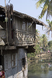 Wooden house at a stream in the town of Mrauk U, Myanmar