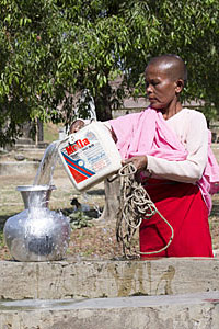 nun at a well