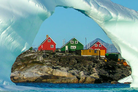Greenland houses with iceberg