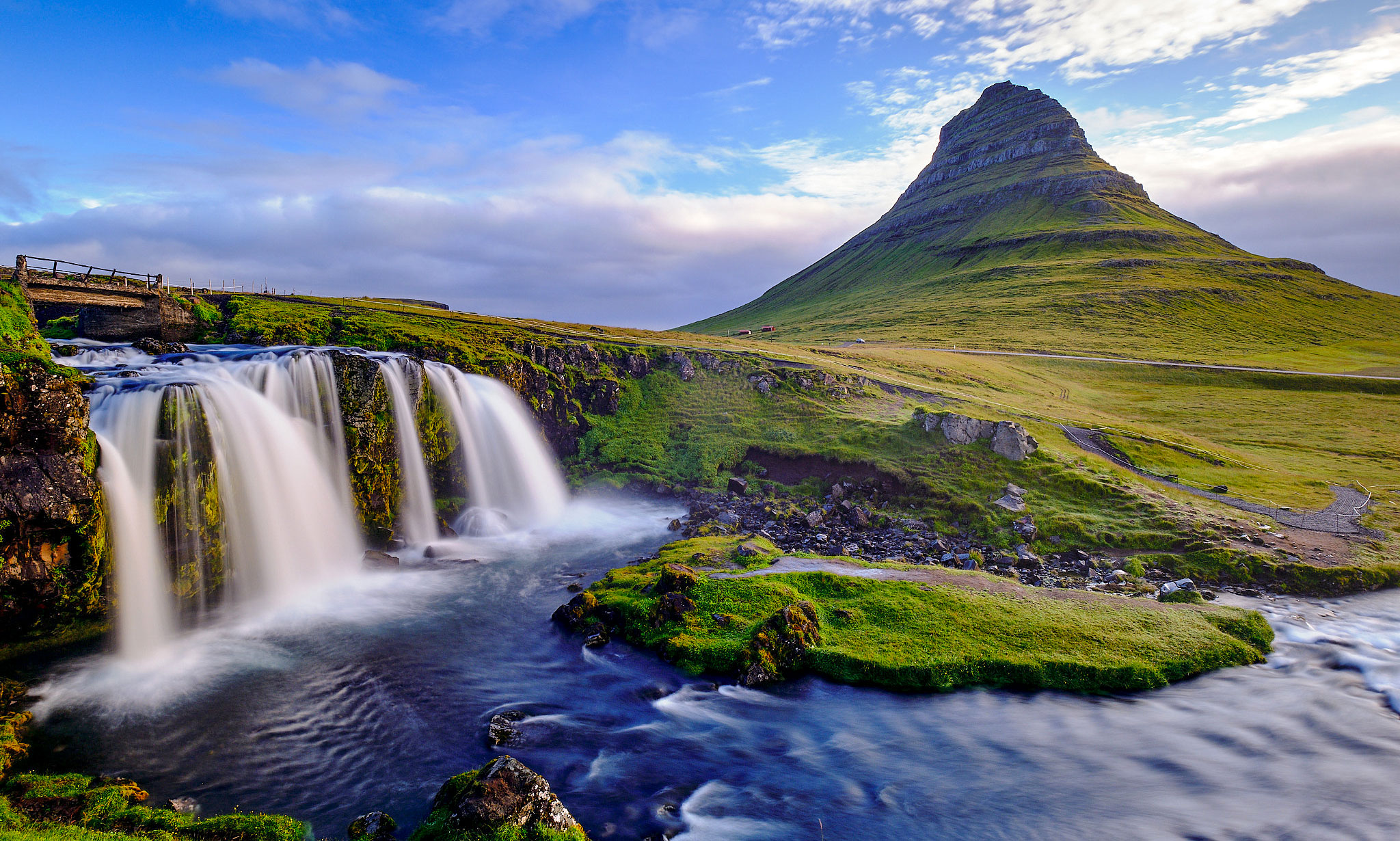 Mt. Kirkjufell and Kirkjufellsfoss waterfall near the town of Grundarfjörður in the north of the Snæfellsnes peninsula. 