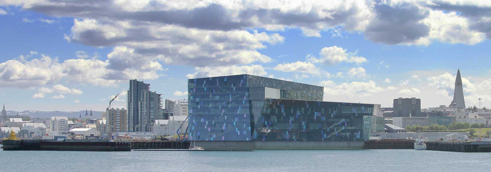 Reykjavik's harbor with Harpa concert hall and Hallgrímskirkja