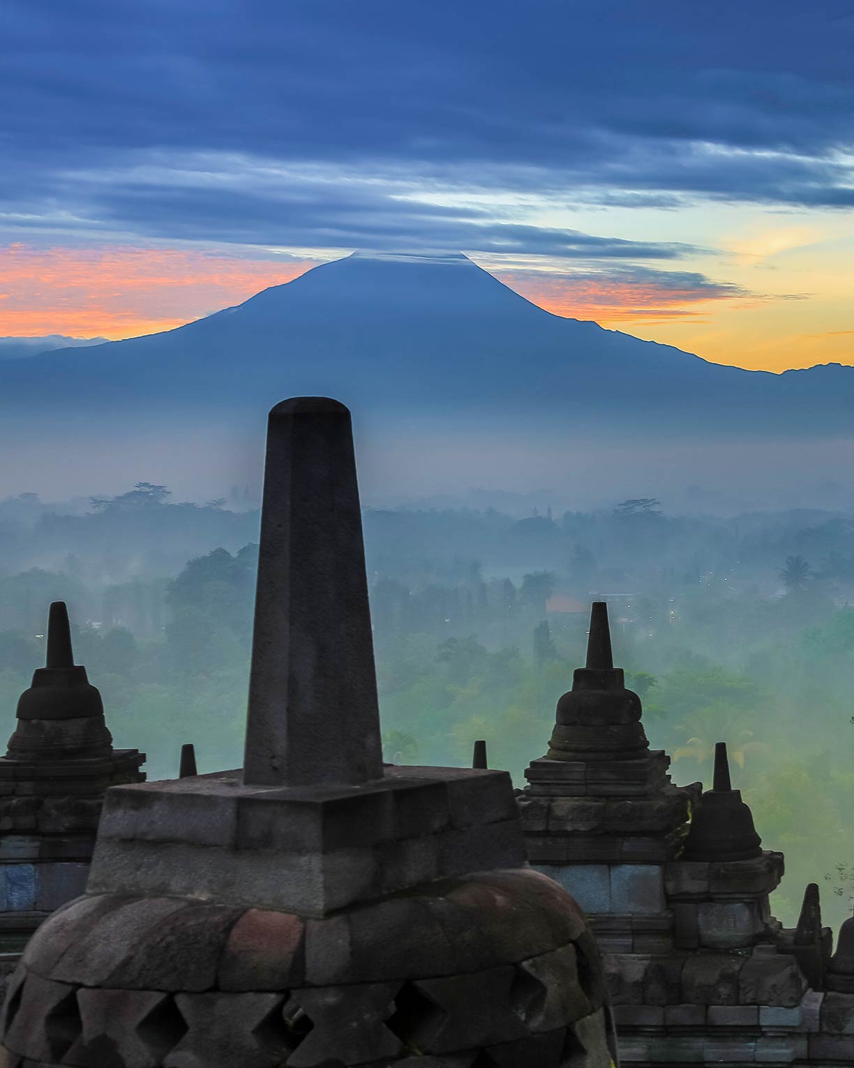 Stupas at sunrise in the Borobudur Temple Compound of  Indonesia