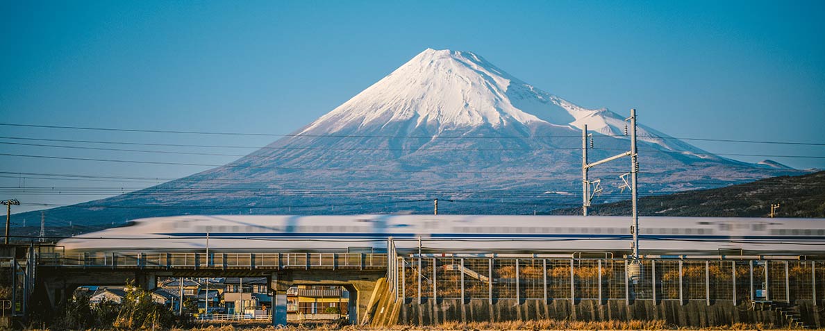 Shinkansen, a Japanese high-speed train passes Mount-Fuji.