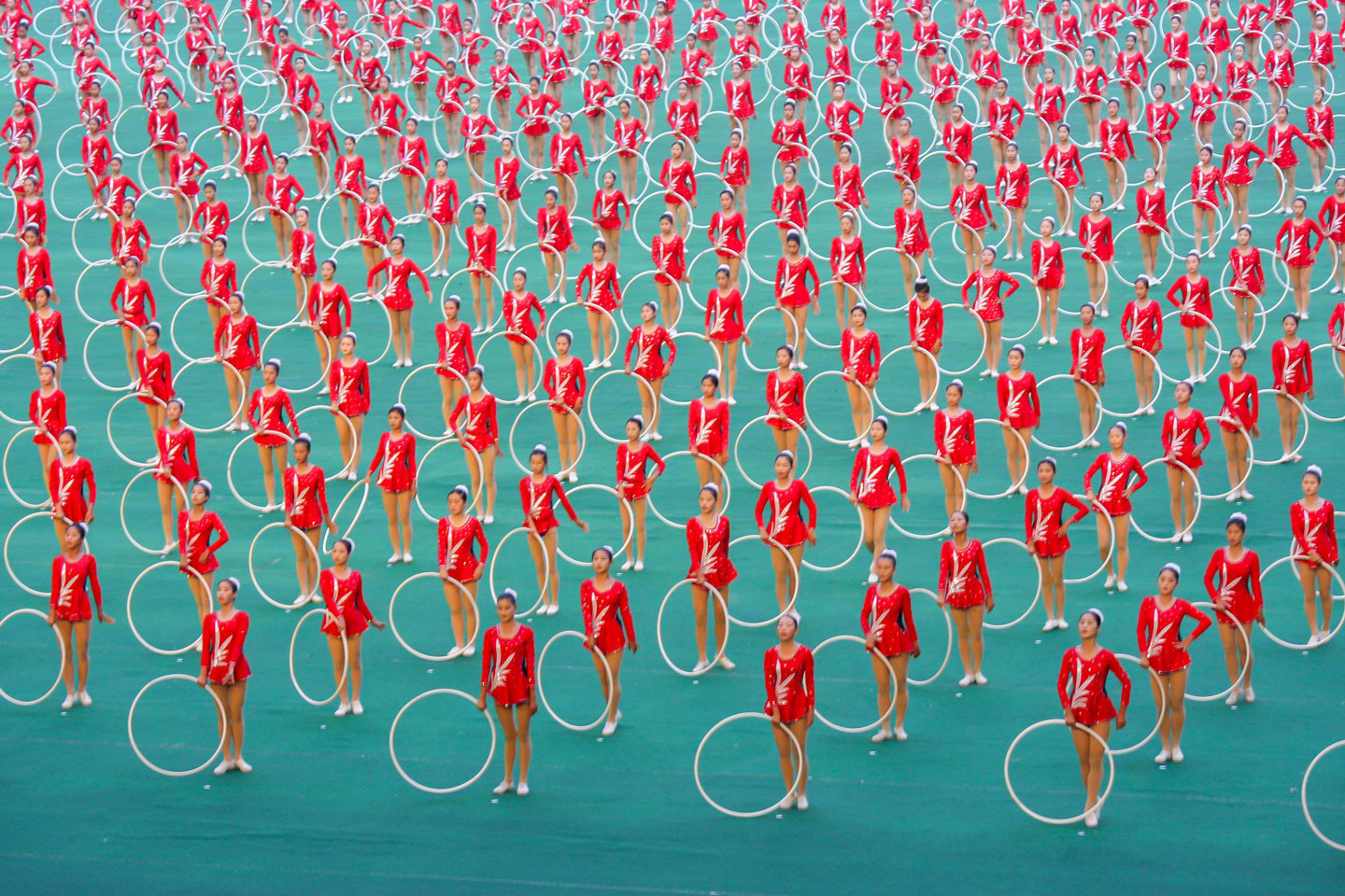 North Korean gymnasts performing with hoops at the Arirang Games in Pyongyang.