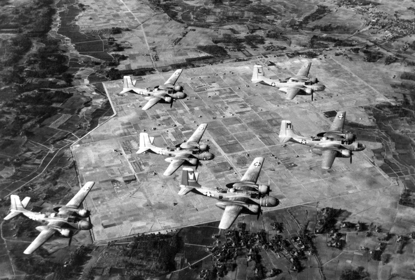 The photograph shows United States Air Force B-26 Douglas Invader light bombers on a recent routine training flight over Japan. Aircraft such as these are being used against the Communist aggressors in Korea.