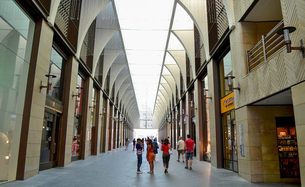 Shopping stores along vaulted alleys inside the Beirut Souks.
