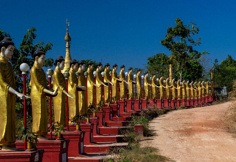 A line of Buddha statues in Bago.