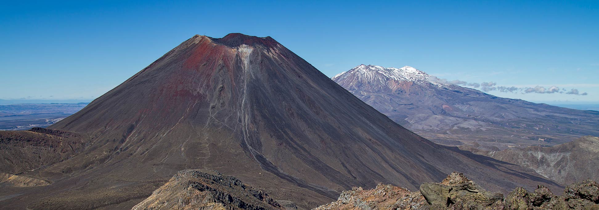 Mount Ngauruhoe seen from Mount Tongariro, with Mount Ruapehu in the background