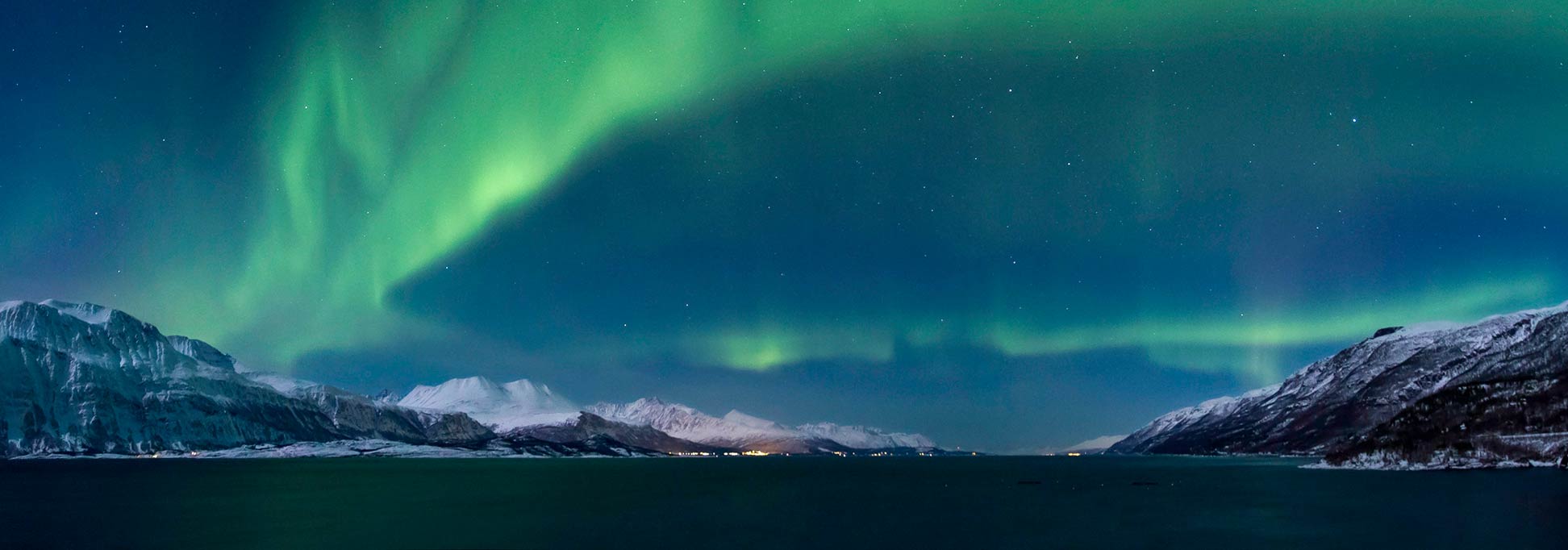 Northern lights (Aurora borealis) over the Lyngen fjord in Norway