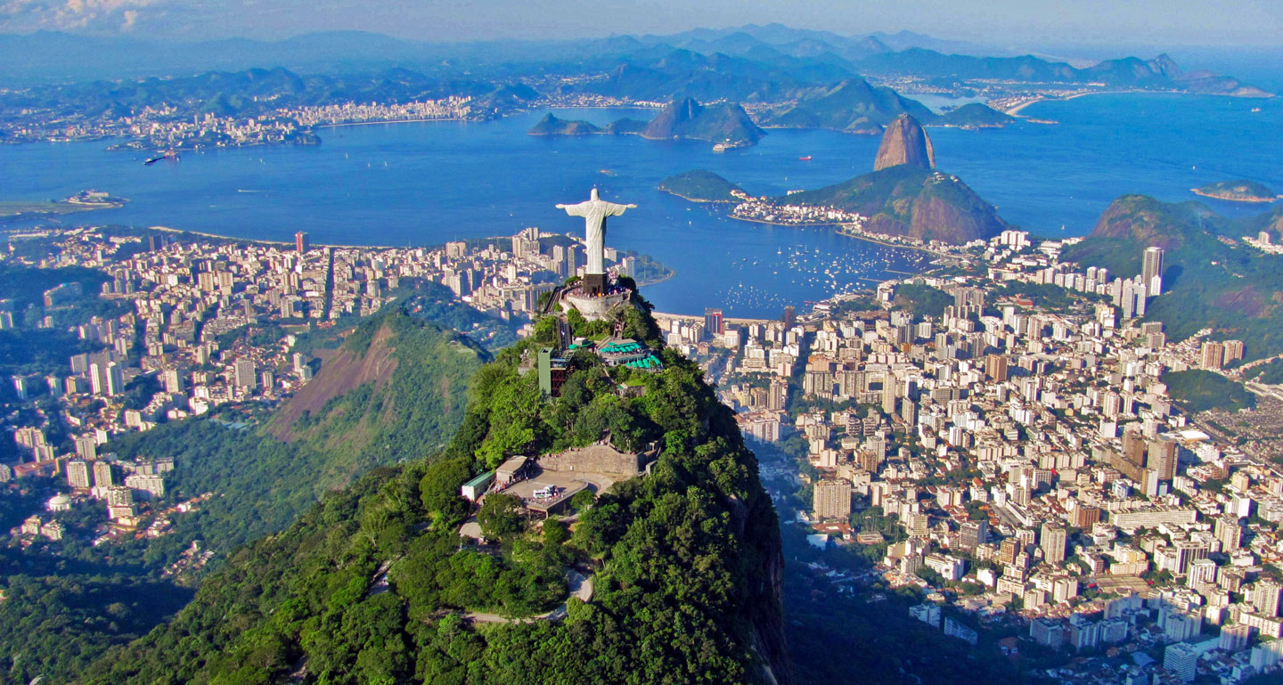 Aerial view of Rio de Janeiro with Christ the Redeemer statue on Mount Corcovado and Sugarloaf Mountain in the background