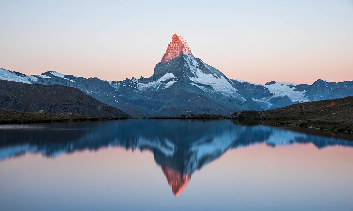 The Matterhorn (4,478 m) and its reflection on the Stelli Lake, Switzerland
