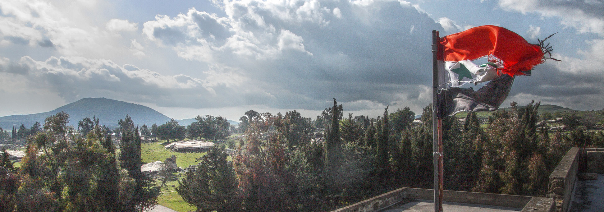 Flag of Syria over Al Quneitra, the former capital of the Quneitra Governorate in Syria