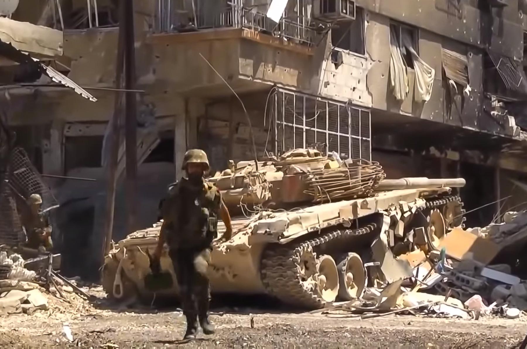 Syrian army during urban fighting supported by tanks