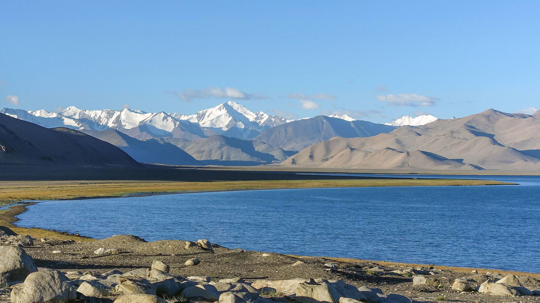 Lake Karakul with the eastern Pamir mountain range in the background.