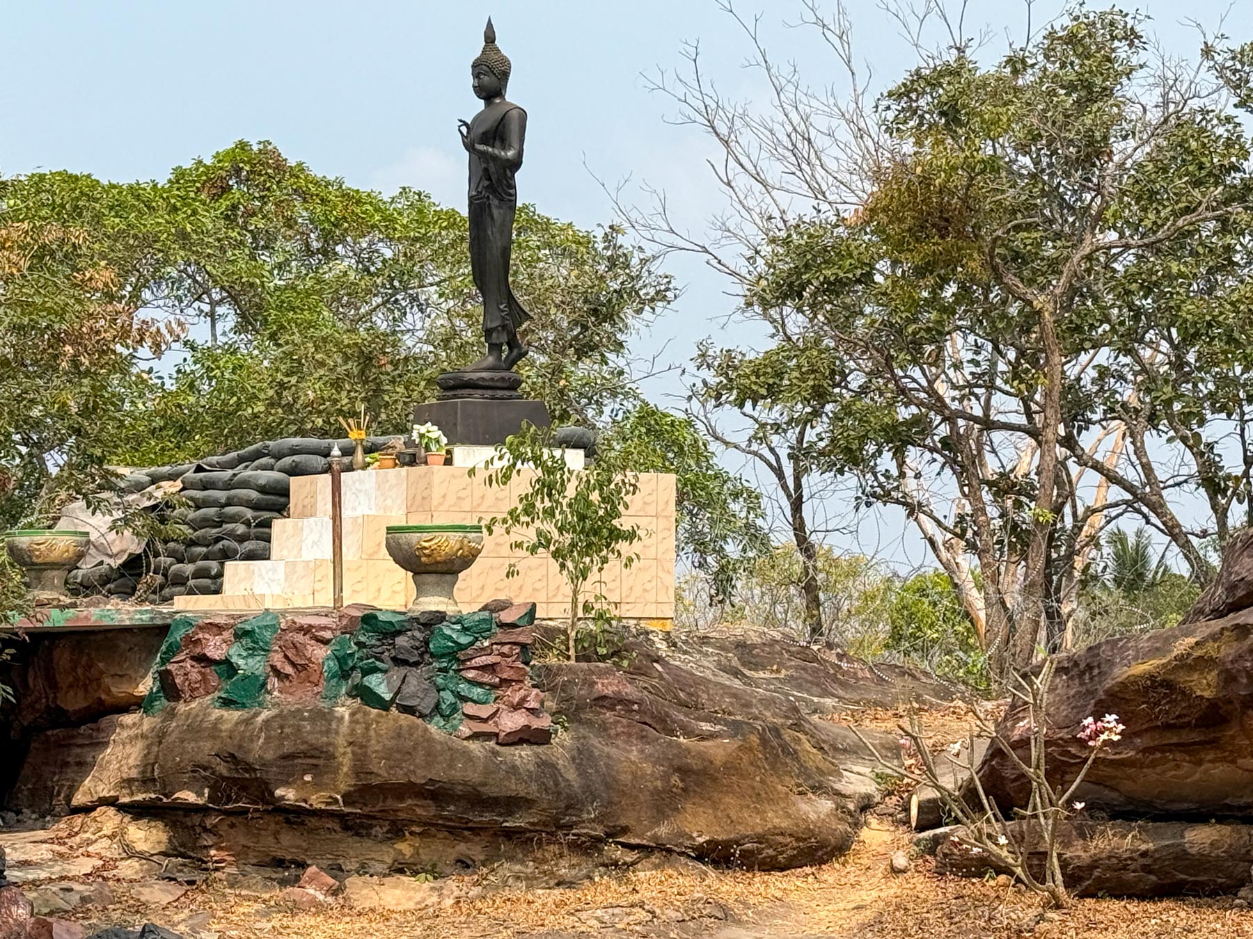 Thai military shelters surround a Buddha statue in the Thai-Cambodian border area