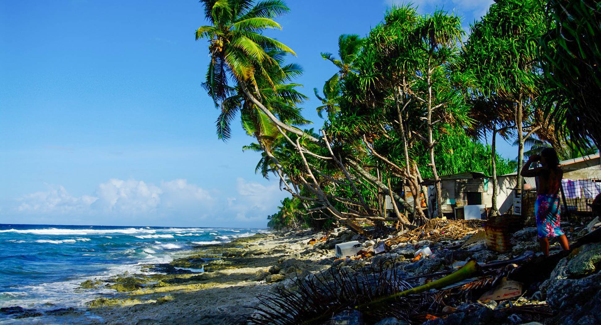 Beach scene on Tuvalu with lots of civilization garbage.