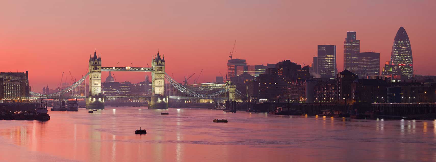 Skyline of UK's capital, seen from Bermondsey banks of the Thames with the Tower Bridge, London, UK