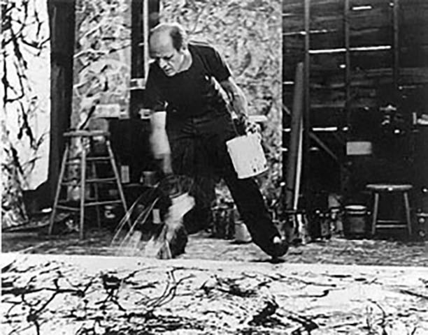 Jackson Pollock painting with his "drip" method