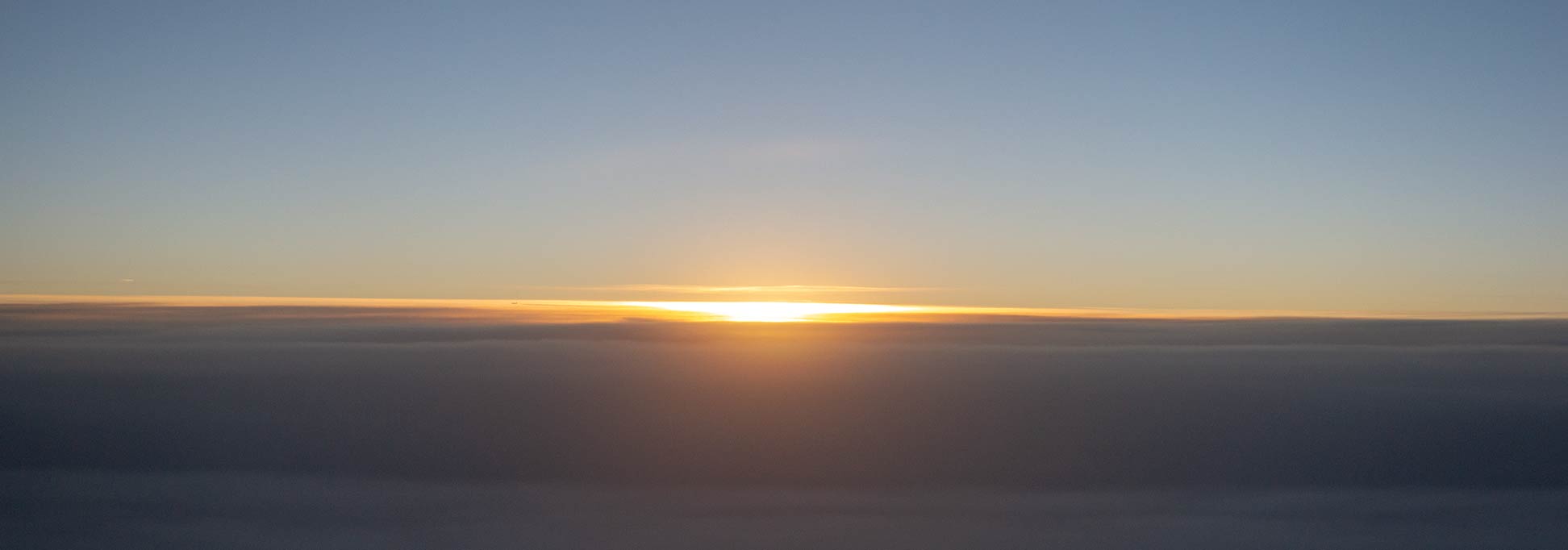 Over the clouds: Sunset in the sky